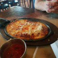 Queso Fundido · Choriqueso. Grilled Mexican sausage with melted cheese. Recommended.