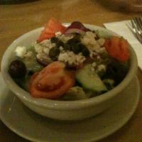 House Greek Salad · Freshly cut romaine and iceberg lettuce, tomatoes, cucumber, olive and feta cheese with red ...