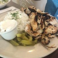 Chicken Shawarma Plate · Chicken shawarma served with a side of garlic sauce, rice and one side.