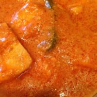 Chicken Tikka Masala · Marinated chicken cooked with sliced onion, bell peppers with tomato sauce, and a touch of c...