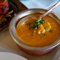 Chicken Curry · Chicken prepared with special sauce from fresh onions, tomatoes, garlic, cloves, and other s...