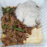 Pad Grapow · Spicy basil. Sauteed with onions, bell pepper, mushrooms and basil.