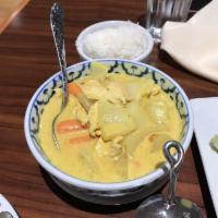 Yellow Curry · Yellow curry cooked with coconut milk, potatoes, carrots, and onions.
