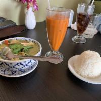 Green Curry · Coconut milk cooked with green curry sauce, vegetables, and sweet basil.