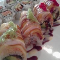 Golden Dragon Roll · Eel avocado inside topped with fresh mango and red wasabi tobiko and special sauce. 