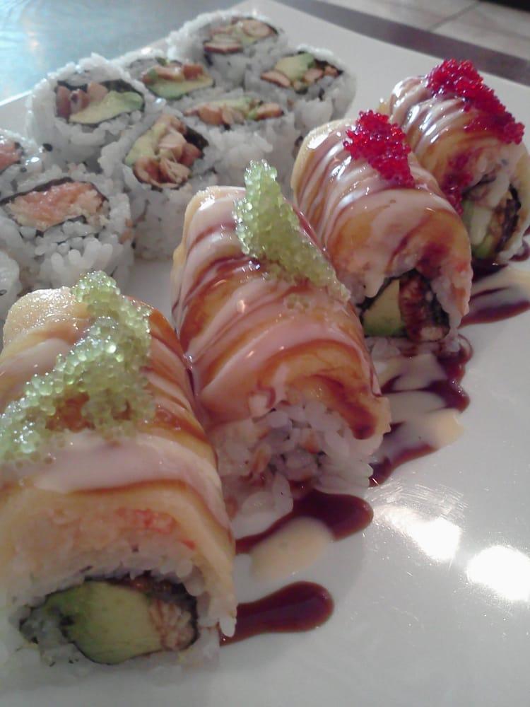 Golden Dragon Roll · Eel avocado inside topped with fresh mango and red wasabi tobiko and special sauce. 