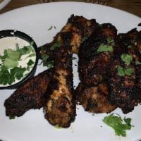 Char Grilled Hot Wings · All-natural, dry rubbed and marinated in Sriracha hot sauce, citrus, garlic and cilantro cha...
