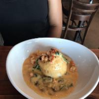 Stuffed Fish · Baked fish stuffed with homemade boudin topped with crawfish, spinach and mushrooms in a lem...