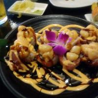 Cherry Blossom Roll · Crab, avocado, cucumber and topped- tuna, salmon, with spicy scallops, eel sauce and spicy m...