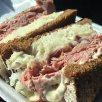 Reuben · Corned beef topped with melted swiss and saurkraut, with our special sauce on pumpernickel b...