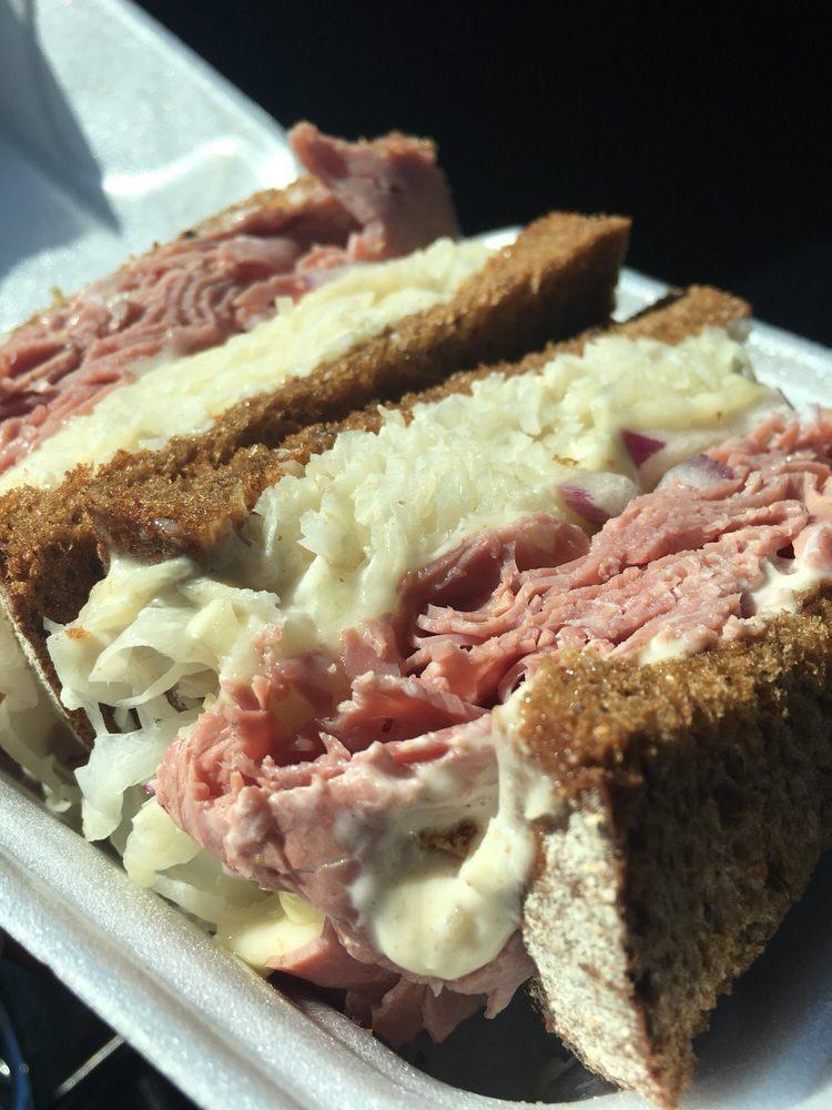 Reuben · Corned beef topped with melted swiss and saurkraut, with our special sauce on pumpernickel bread. 