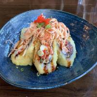 Volcano Roll · Deep fried roll with spicy crab, cream cheese, topped with spicy crab salad, masago, scallio...