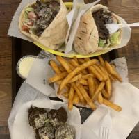 Macdougal Sandwich · Shawarma and falafel: served in a pita pocket with lettuce, tomatoes, onions and tahineh sau...