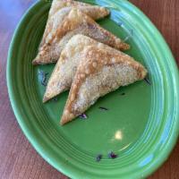 Sambosa · Fried crispy pastry turnovers stuffed with ground beef or vegetables and chickpeas, served w...