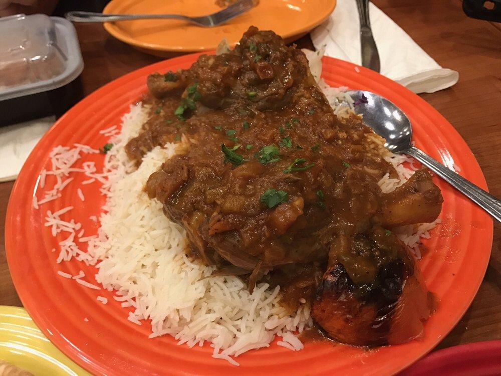 Lamb Shank · Cooked in our special herbs and tomato sauce. Served with pita bread and rice (substitute Salad or Vegetables for $2.00)