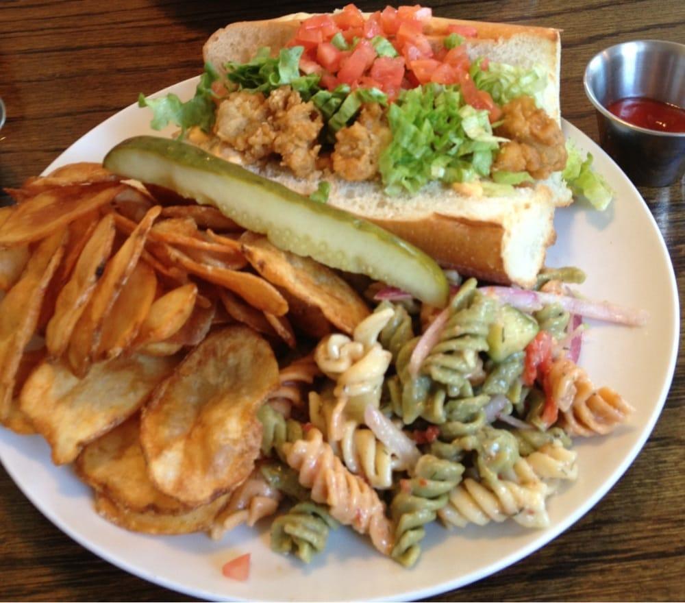Po Boy · Toasted hoagie stuffed with shrimp, oysters or both with shredded lettuce, tomatoes and garlic mayo.