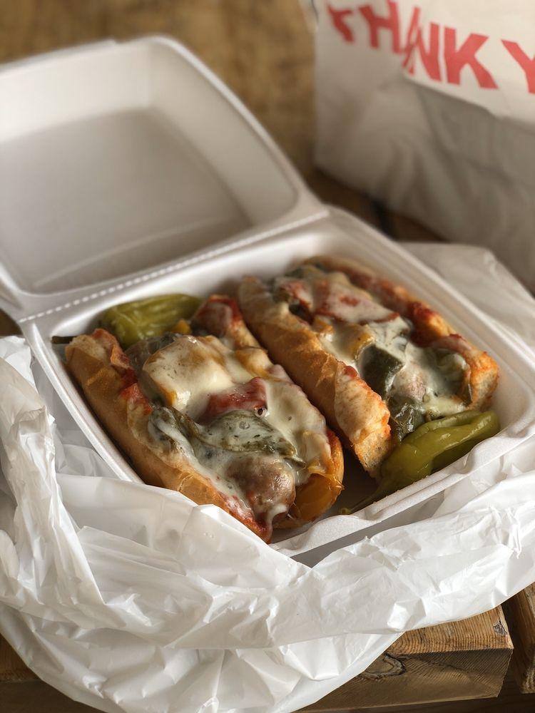 Italian Sausage Sandwich · Italian sausage topped with bell peppers, onions, marinara sauce and provolone cheese.