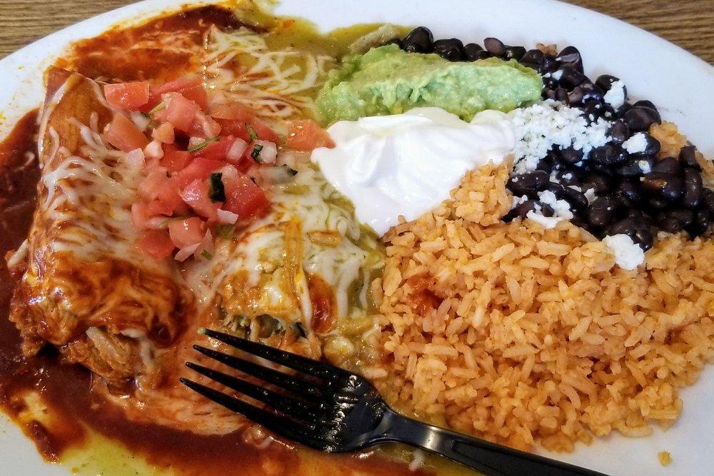 Tamales · Two pork or chicken tamales topped with red sauce and cheese. Served with Spanish rice, beans, sour cream, lettuce, guacamole, and tortillas.