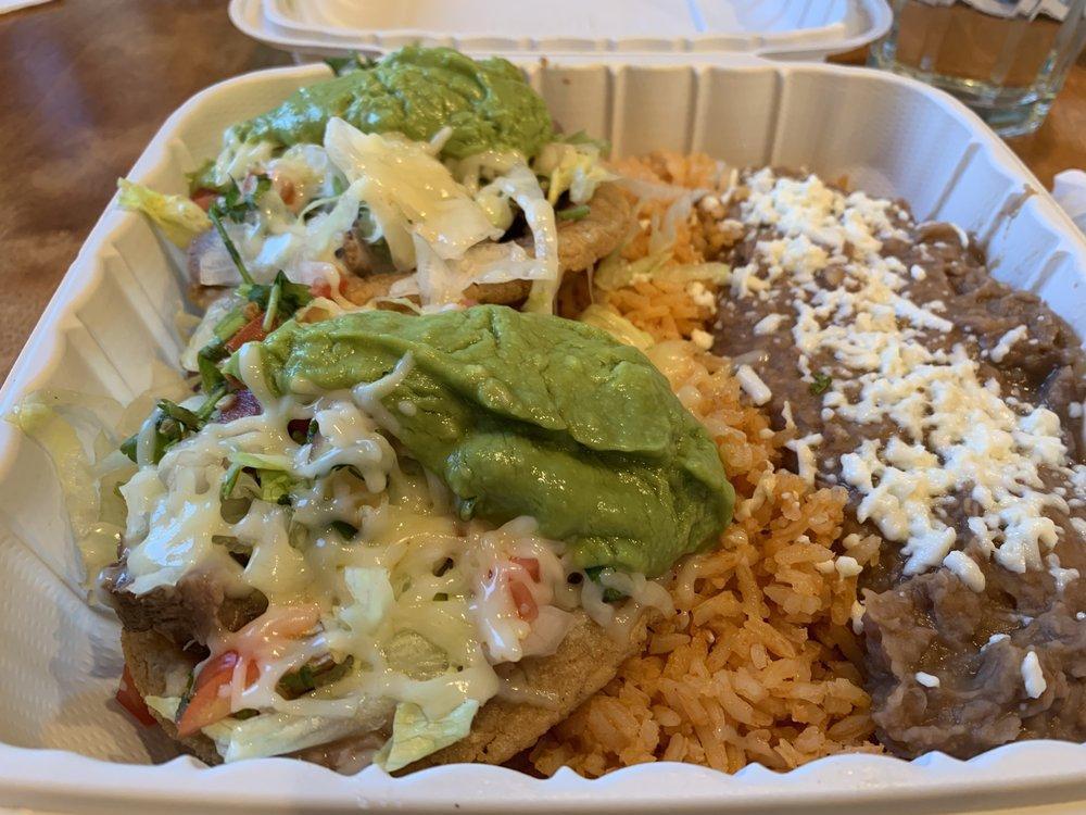 Sopes · Two fried masa bowls with meat. Topped with lettuce, cheese, and salsa fresca. Served with Spanish rice, beans, sour cream, lettuce, guacamole, and tortillas.