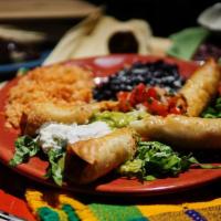 Flautas · 2 rolled and fried organic flour tortillas, choice of shredded chicken, shredded beef or car...