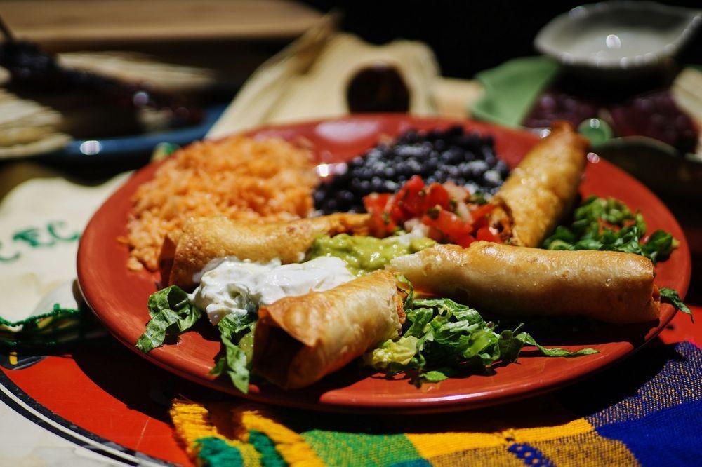 Flautas · 2 rolled and fried organic flour tortillas, choice of shredded chicken, shredded beef or carnitas, choice of beans, tomato rice, sour cream and guacamole.