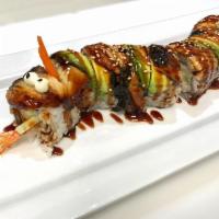 Dragon Roll · In: Crab mix, cucumber and avocado. Out: Eel, avocado and eel sauce. Cooked.