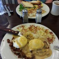 Eggs Benedict Benedict · English muffin with canadian bacon and poached eggs, topped with hollandaise. Served with ha...