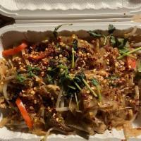 Spicy Drunken Noodles · Pan fried flat rice noodles with garlic, chili, mint leaves and sprouts.