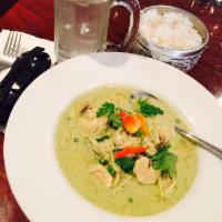 Green Curry · Served with sliced bamboo shoots, peas and carrots.