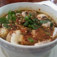 Tom Yum Koong Soup · Shrimp and mushrooms with lemongrass in a hot and sour soup.