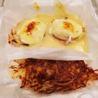 Eggs Benedict · A toasted English muffin topped with Canadian bacon, 2 poached eggs, and topped with holland...