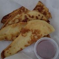 French Toast · 4 thick slices of sourdough bread dipped in our French batter. Dusted with powdered sugar. S...