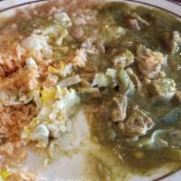 Chile Verde Burrito · Pork meat in green sauce. Served with rice, beans, onions, cilantro, lettuce, and salsa. Top...