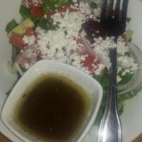 Greek Salad · Lettuce, tomato, red onion, feta cheese, olives and cucumbers with Italian house dressing.