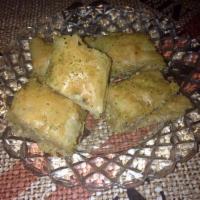 Baklava · Served with walnuts and rose water syrup.
