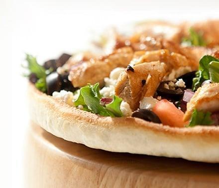 Mixed Greens Pizza · Marinated, fresh grilled chicken, mixed greens lettuce, tomatoes, onions, olives, feta cheese and special dressings.