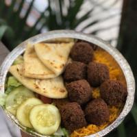 Falafel Platter · served with Basmati Rice, lettuce,tomato,sauteed onion&pitta bread,white sauce.