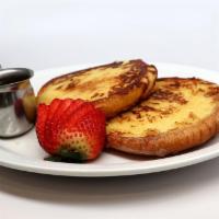 French Toast · Creme brulee battered and served with pure maple syrup.