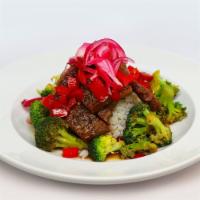 Peppercorn Crusted Steak Bowl · Peppercorn crusted steak, broccoli, Red peppers, pickled red onions and balsamic glaze.