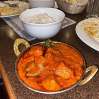 Chicken Tikka Masala · Tender boneless chicken pieces boiled in tandoori and cooked in a mild creamy tomato gravy.