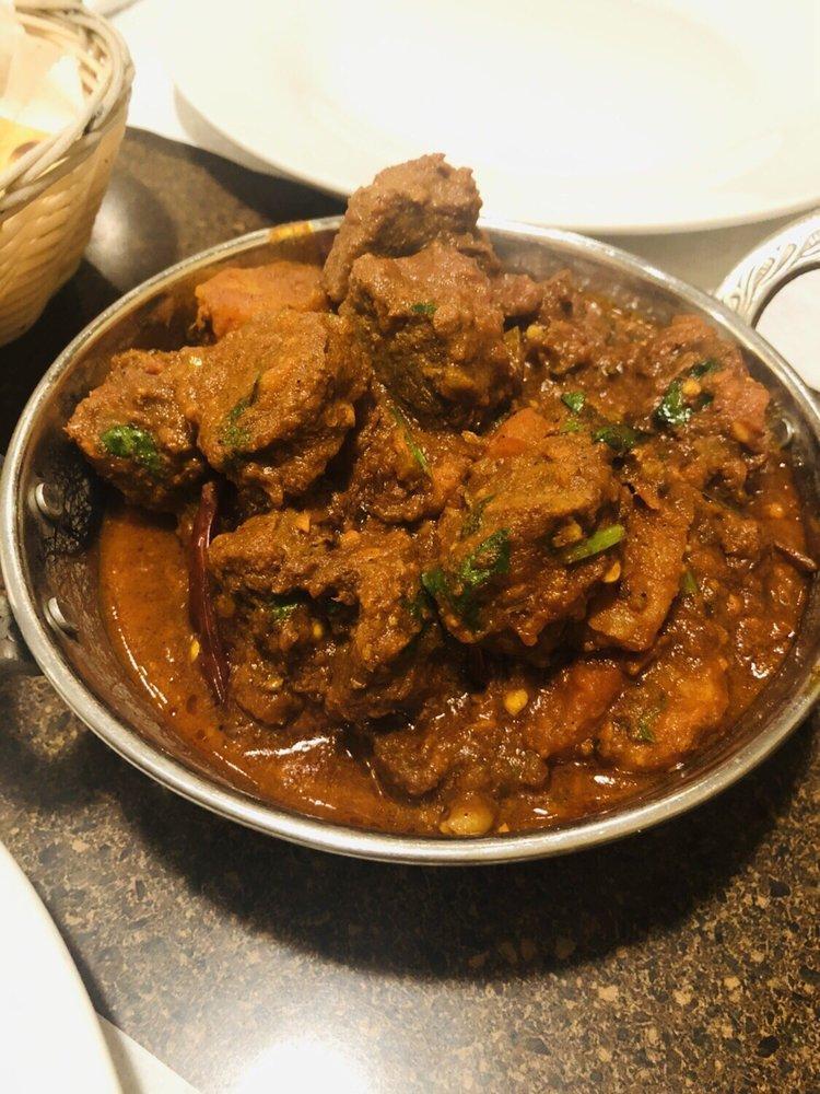 Lamb Vindaloo · Tender lamb cooked in fiery red hot curry sauce.