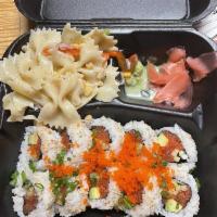 Spicy Tuna Roll · In: avocado, spicy tuna, cucumber. Out: sesame seeds onion, masago.