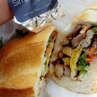 Simply Chicken Banh Mi · Includes, cucumbers, cilantro, jalapenos, soy sauce, in-house mayonnaise, pickled carrots an...