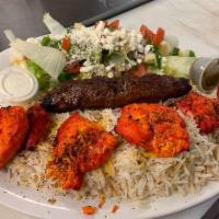 Chicken Kabob · Chicken marinated with rich ingredients, grilled on open fire,served with naan, rice and sal...