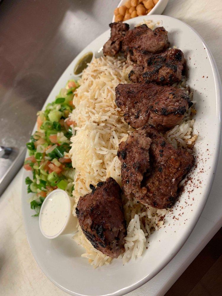 Beef Kabob · Chunks of Beef marinated with Afghan spices. Grilled to perfection
Served with naan ,rice and salad  (Green chutni white sauce and a side of beans)
