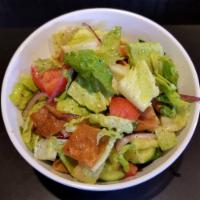 Fattoush Salad · Romaine lettuce, tomatoes, Persian cucumbers, red onions, and pita chips, tossed with specia...