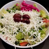 Greek Salad · Romaine lettuce, tomatoes, Persian cucumbers and red onions topped with black Kalamata olive...