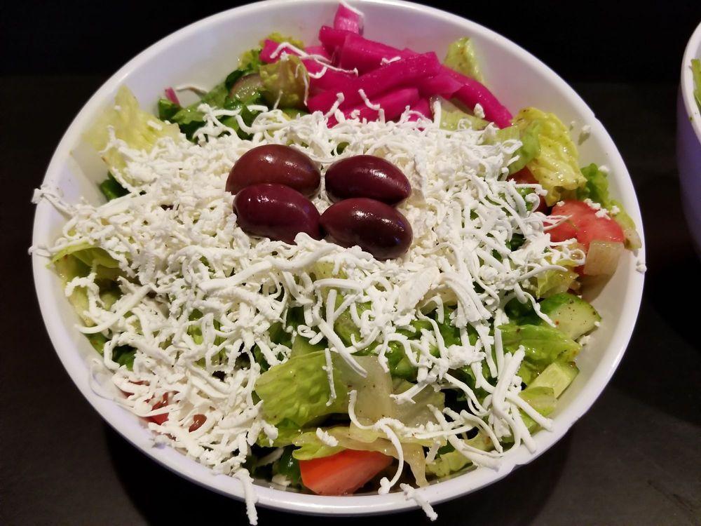 Greek Salad · Romaine lettuce, tomatoes, Persian cucumbers and red onions topped with black Kalamata olives and feta cheese, tossed with special seasoned dressing.