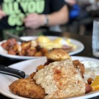 Chicken Fried Steak · Hand-breaded cube steak, 2 eggs, country sausage gravy, Cadillac potatoes and toast.