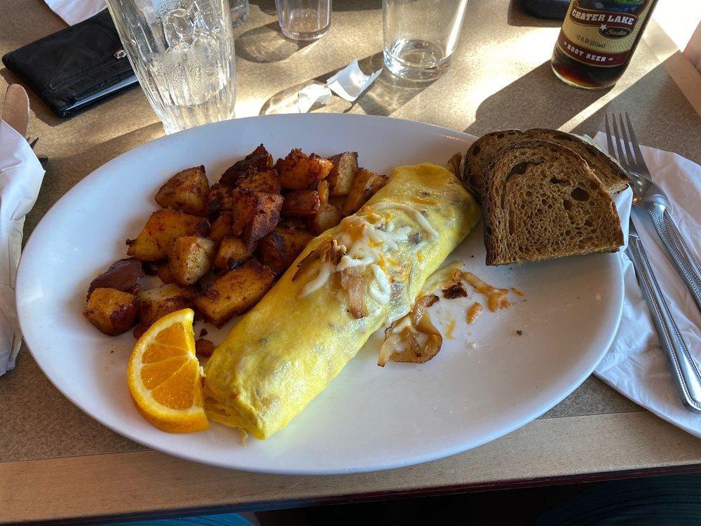 Mixed Grill Omelette Breakfast · Bacon, ham, chicken apple sausage, sauteed mushrooms, caramelized onions and 3 cheese blend.